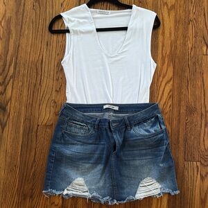 White Sleeveless Top and Distressed Denim Skirt
